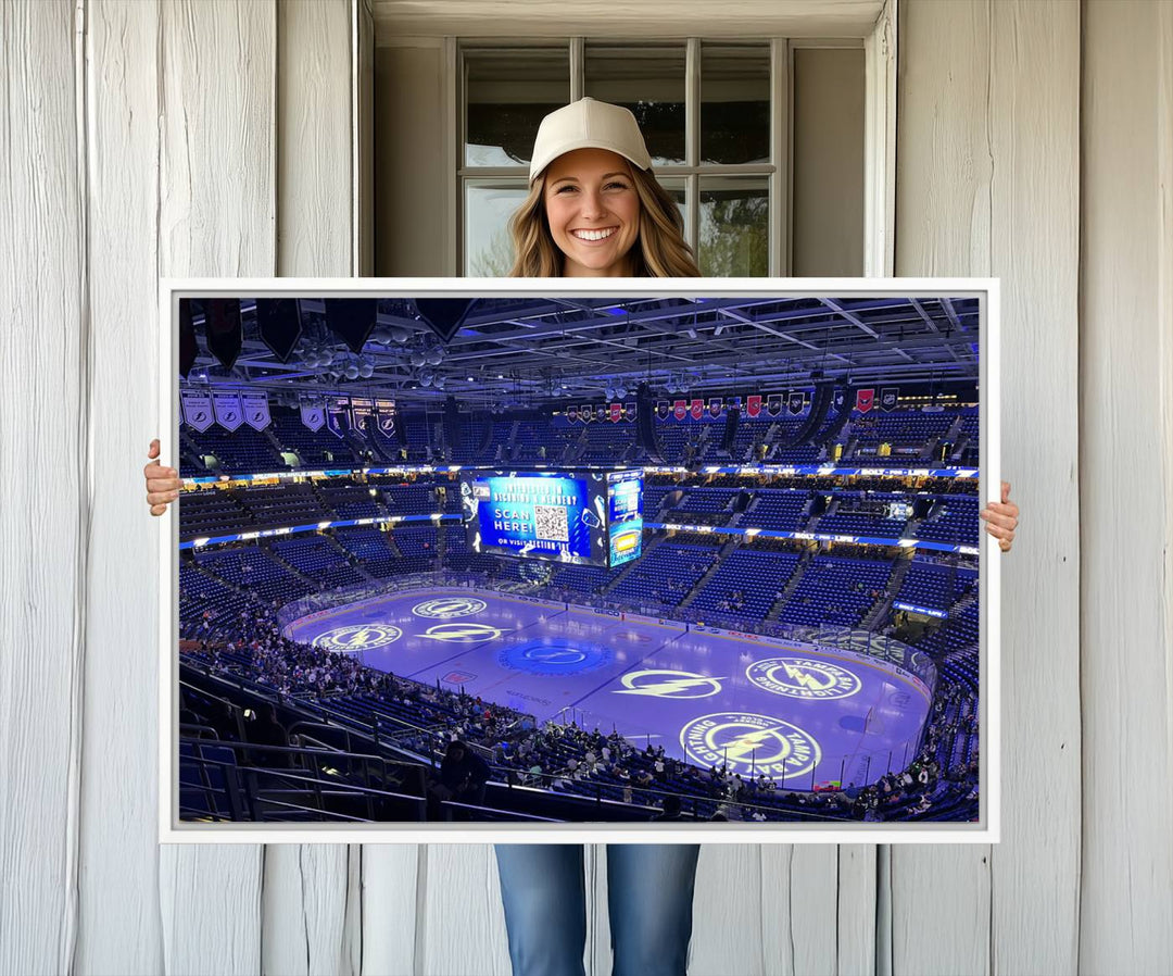 The wall art canvas print at Amalie Arena features team logos on ice, encapsulating the vibrant atmosphere of an NHL hockey stadium.