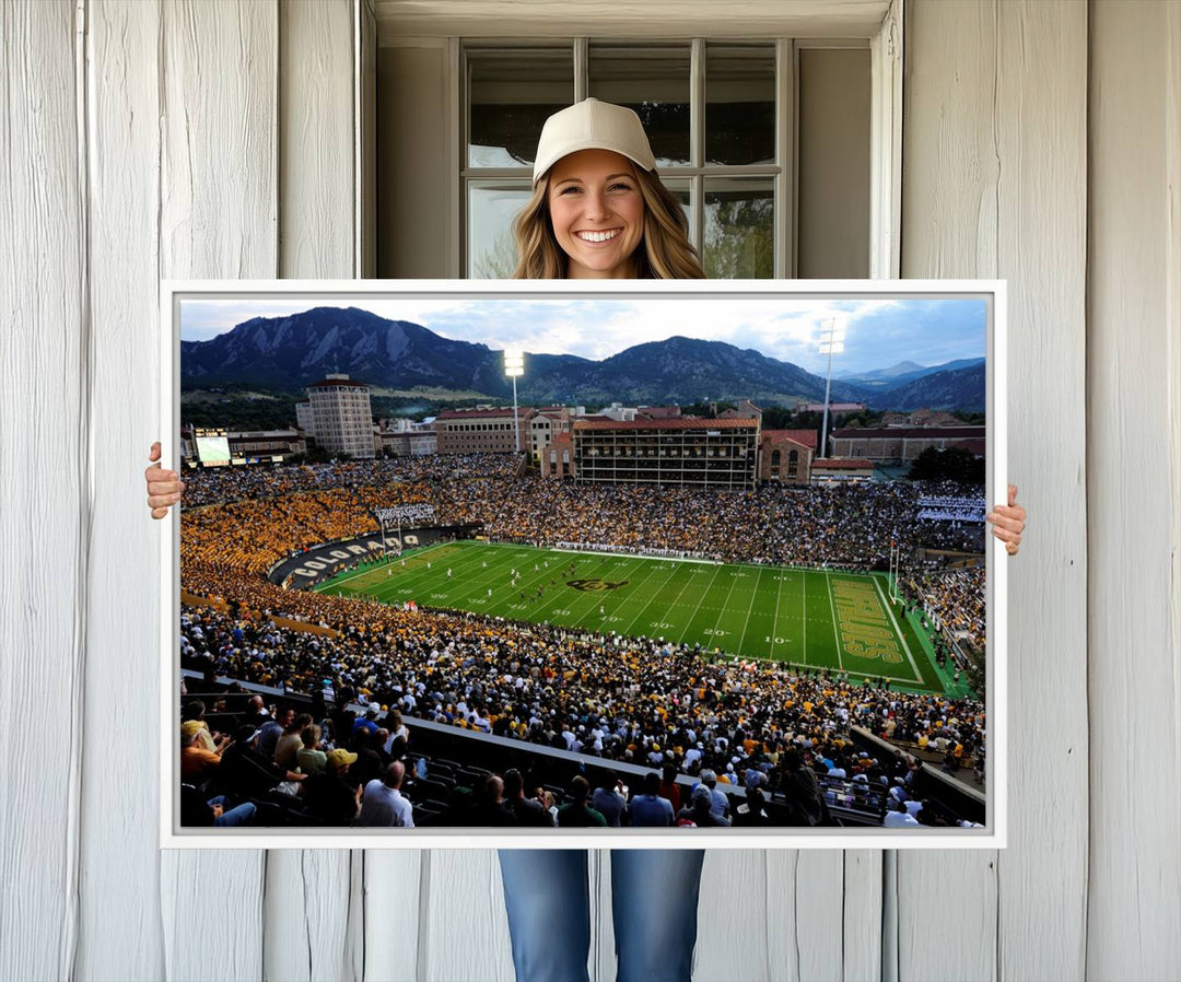 A canvas print captures the Colorado Buffaloes at Folsom Field, framed by mountains in the background.