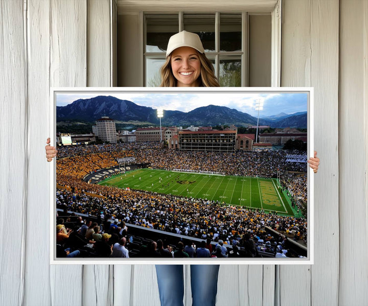 A canvas print captures the Colorado Buffaloes at Folsom Field, framed by mountains in the background.