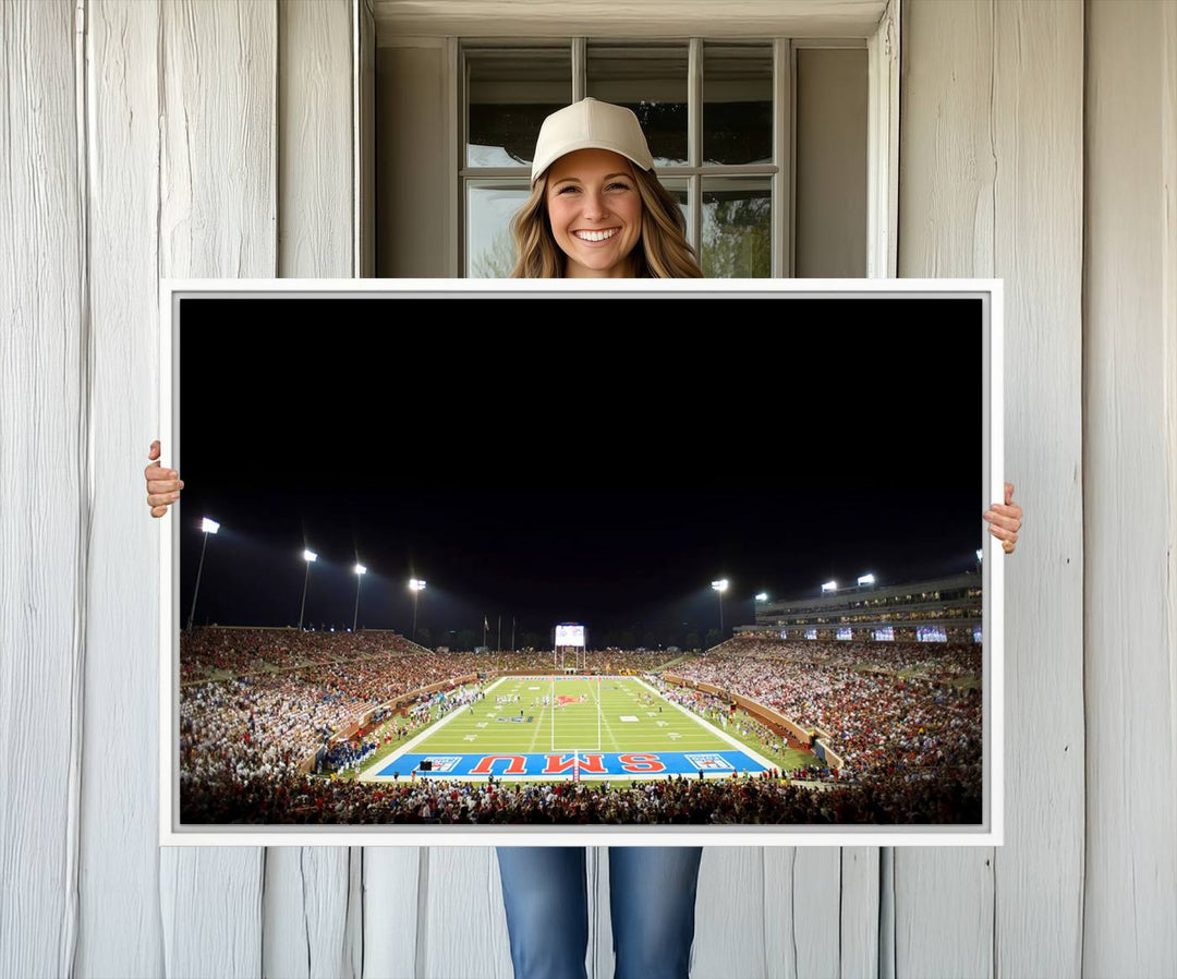 Wide-angle view of a vibrant painting depicting SMU Mustangs Football at Dallas Gerald J. Ford Stadium, capturing the energy and excitement of a filled stadium and brightly lit field.