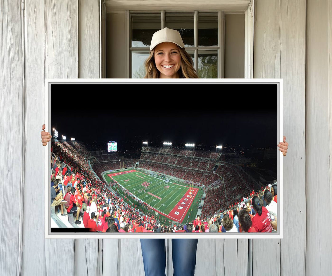 The wall art canvas print features a scene from a packed TDECU Stadium at night, highlighting the field and scoreboard.