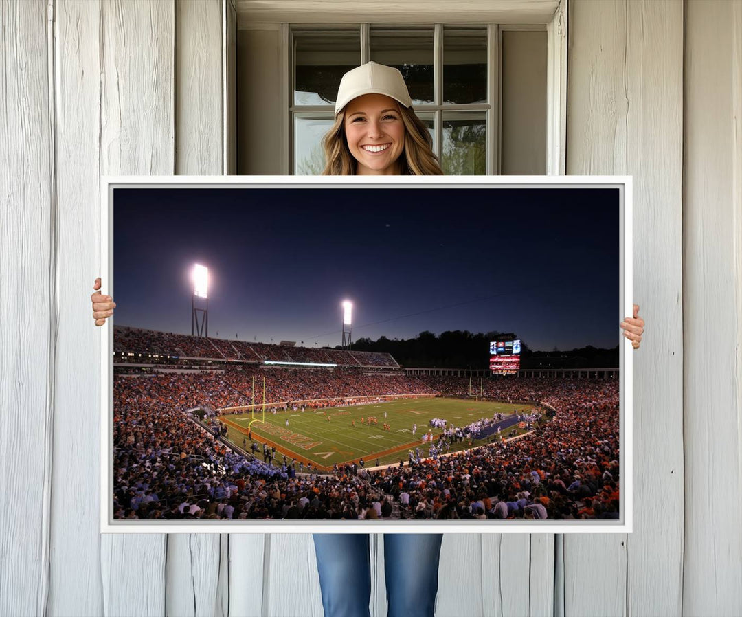 A nighttime game at Scott Stadium, floodlit—a scene from the Virginia Cavaliers Football art print.