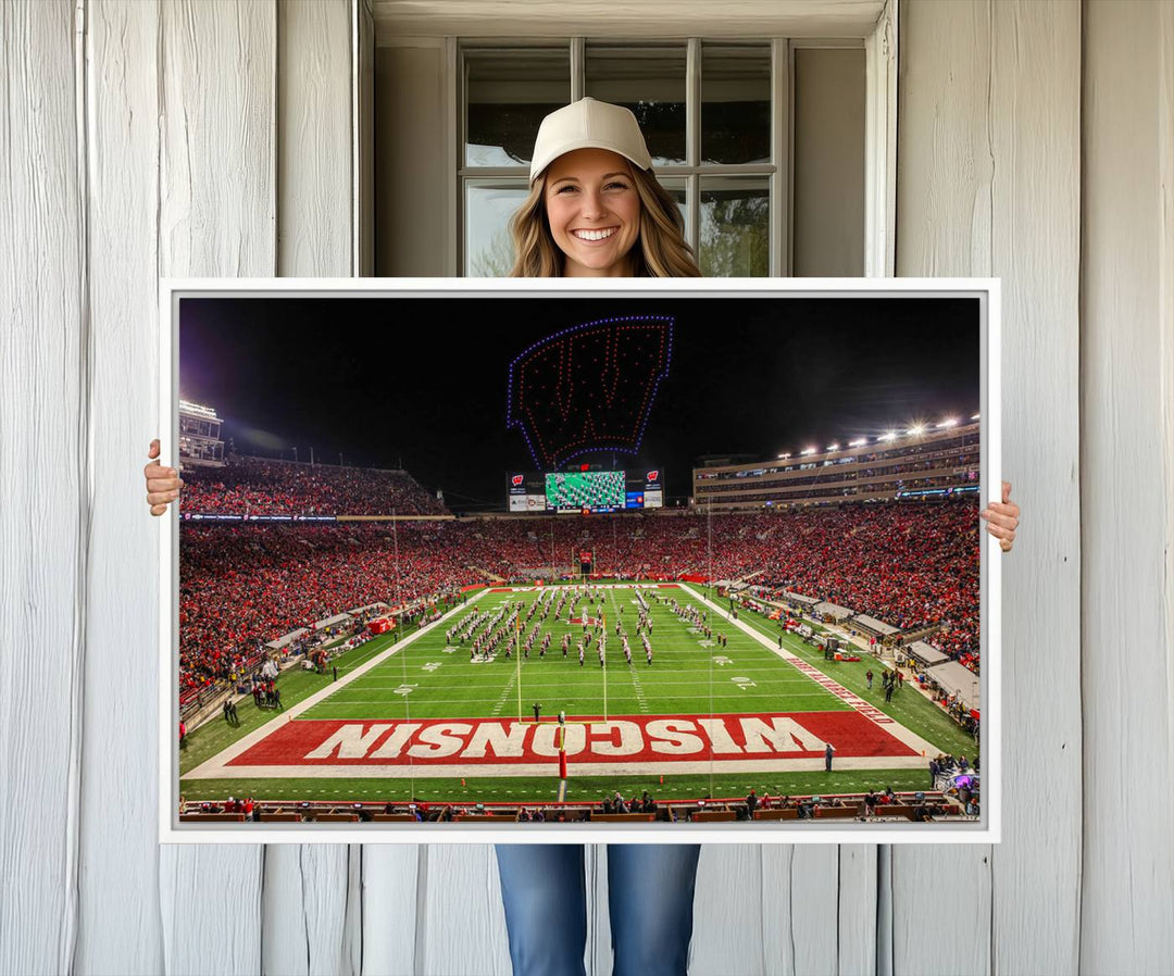 A premium canvas print captures a vibrant scene of Camp Randall Stadium featuring a lively football game with cheering fans and the energetic movements of the band.