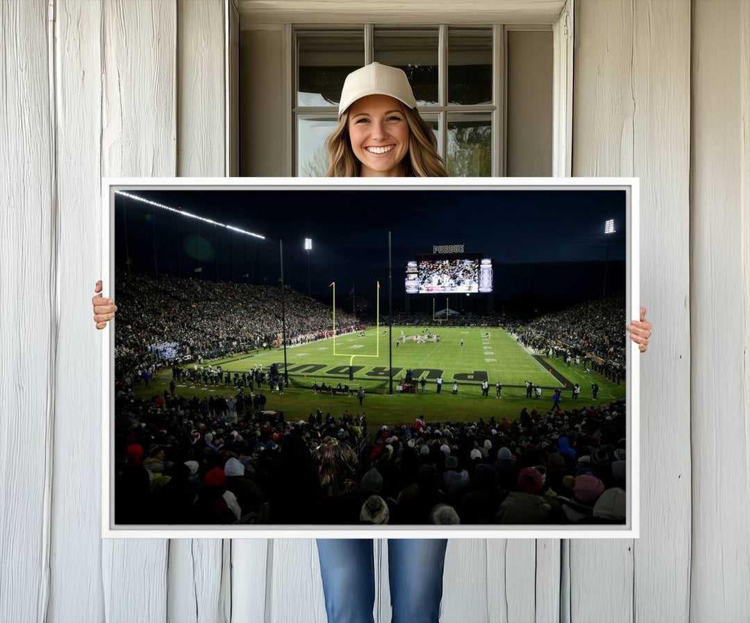 A Purdue Boilermakers canvas print beautifully showcases Ross–Ade Stadium in West Lafayette, vibrant with fans and a large screen display.