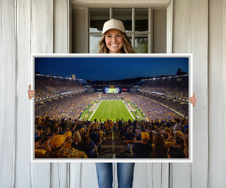 A Pittsburgh Panthers Acrisure Stadium canvas print captures the thrill of a packed stadium under lights and fans cheering.