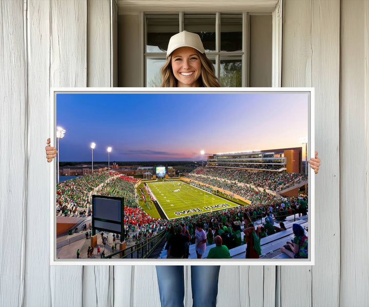 The canvas features Denton DATCU Stadium, OZEKI FIELD, illuminated under the lights and vibrant with fans supporting the University of North Texas.