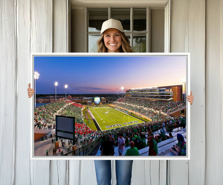 Aerial view of University of North Texas DATCU Stadium at sunset on canvas, showcasing a colorful sky.