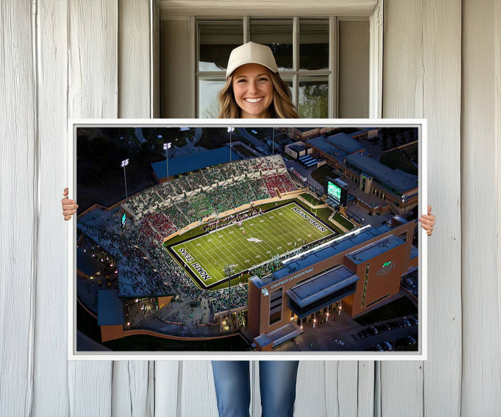 Night aerial view of fans at UNT Mean Green game captured on premium DATCU Stadium canvas wall art print.