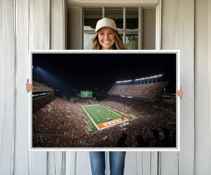 A football game at a packed stadium is captured on the University of Texas Longhorns Stadium Canvas Print.