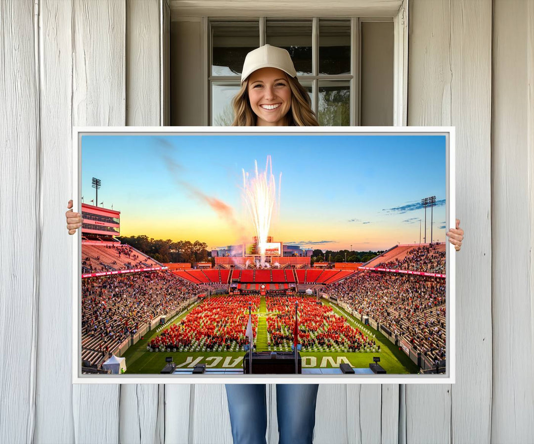 A vibrant North Carolina State University Wolfpack print, capturing a people-filled stadium, fireworks, and a sunset—perfect for your living room wall.