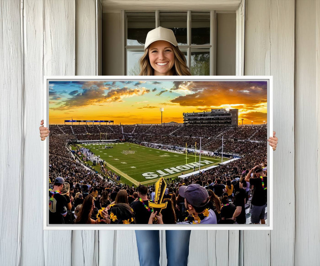 A sunset football game at UCFs Stadium—ideal as a premium wall art canvas print for your home.