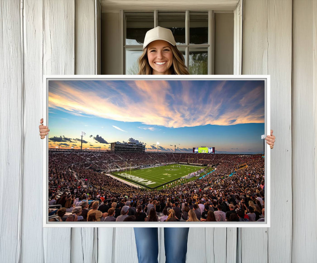 A vibrant wall art canvas captures a sunset scene at Orlandos FBC Mortgage Stadium, featuring the UCF Knights.