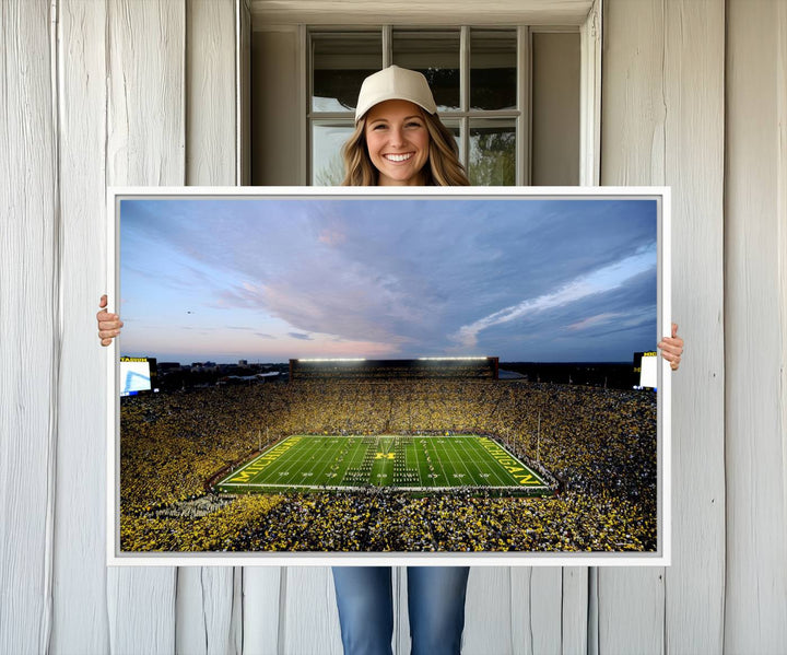 Gallery-quality canvas print of Michigan Stadium at sunset.