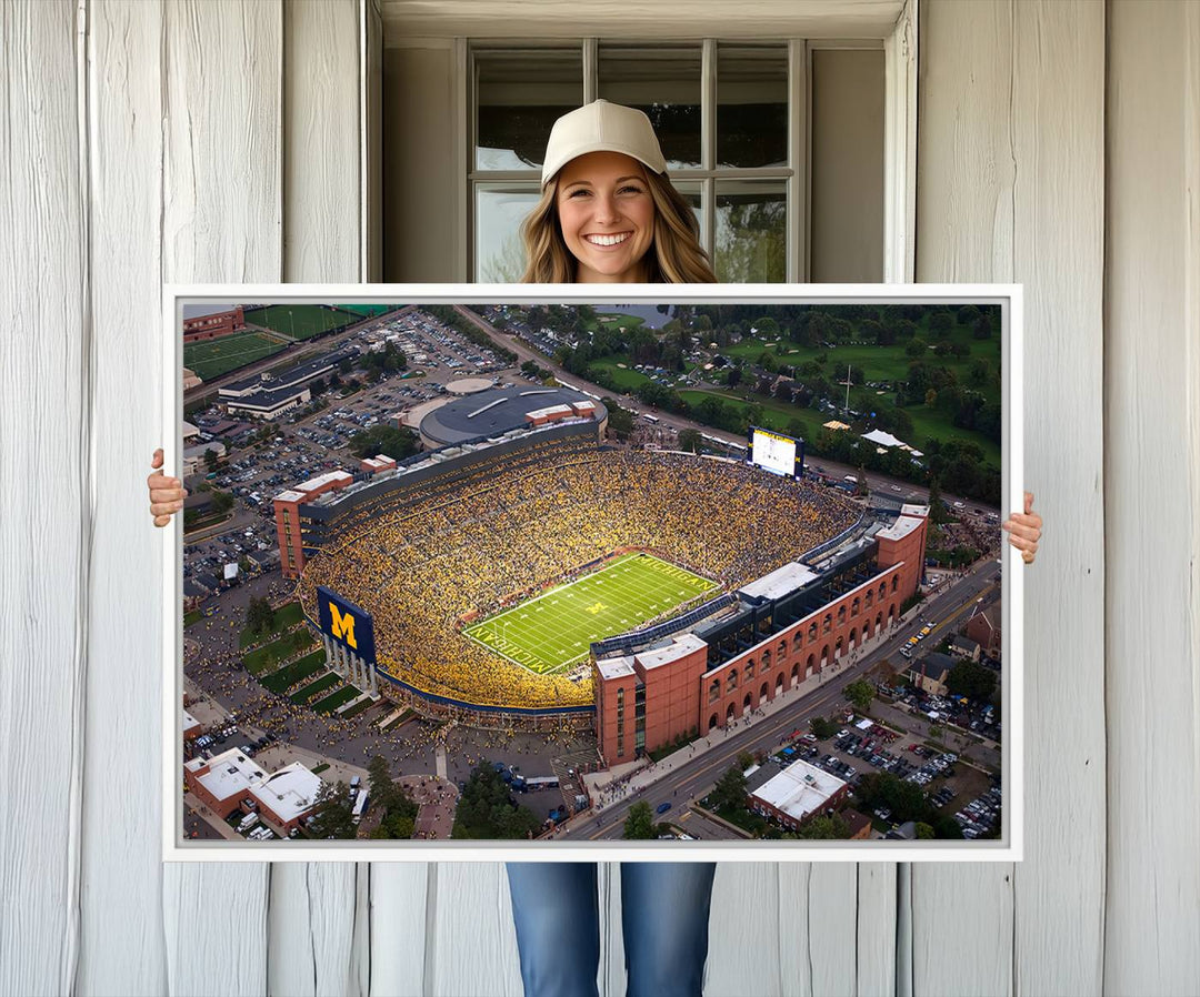 Canvas print featuring an aerial view of Ann Arbor Michigan Stadium filled with Wolverines fans.