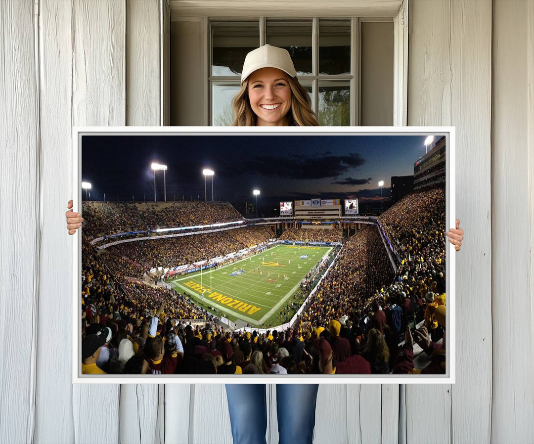 A room featuring an ASU Sun Devils Football Team Print, capturing fans at Phoenix Mountain America Stadium at dusk.