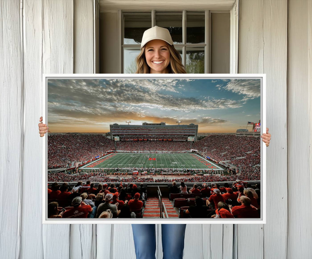 This stunning canvas wall art print features a packed Lincoln Memorial Stadium with the University of Nebraska Cornhuskers at sunset.