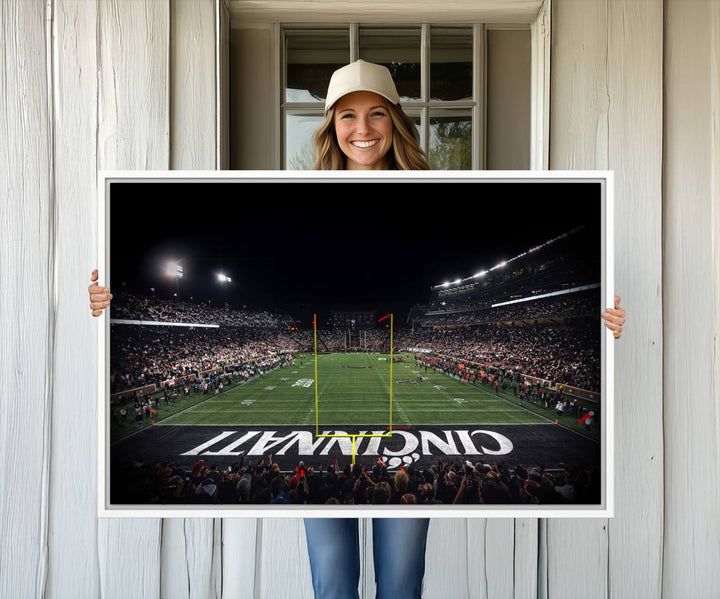 Interior view featuring a Cincinnati Bearcats football canvas of Nippert Stadium.