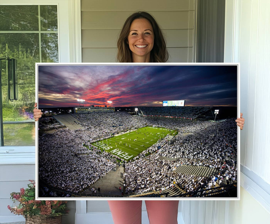 A sunset print on a canvas wall art piece captures the scene of white-clad fans at Beaver Stadium for the Nittany Lions game.