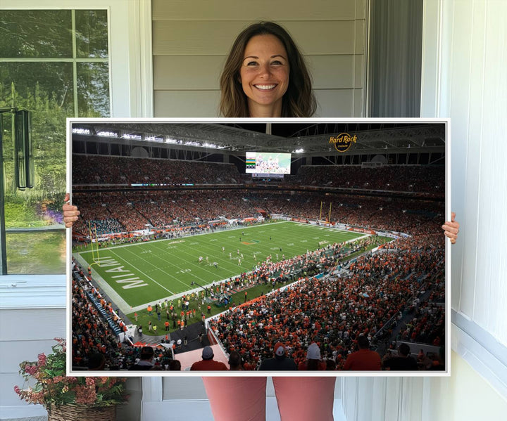 Aerial view of a Miami Hurricanes game at Hard Rock Stadium captured on canvas print, showcasing the teams on the field and fans in the stands.