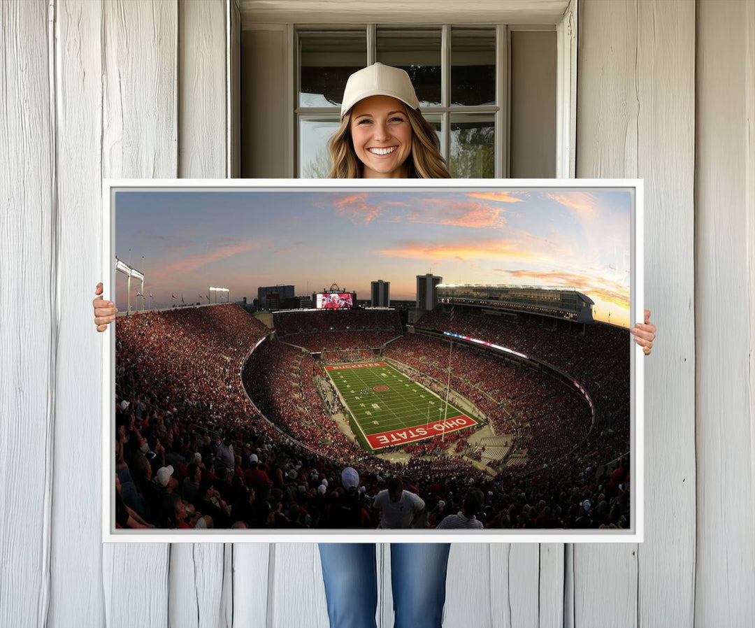 The canvas wall art captures a stunning stadium view of a sunset over Ohio State University Buckeyes football fans.