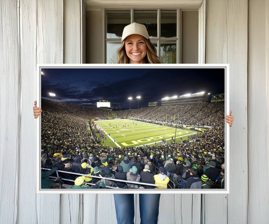 Under bright lights, a University of Oregon Ducks Canvas Print captures the excitement of fans packing Autzen Stadium for a night football game.