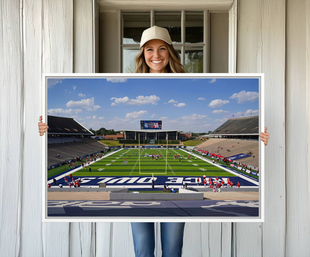 Rice Stadium print: This artwork features a football field with empty stands and a gallery-quality finish under a clear blue sky.