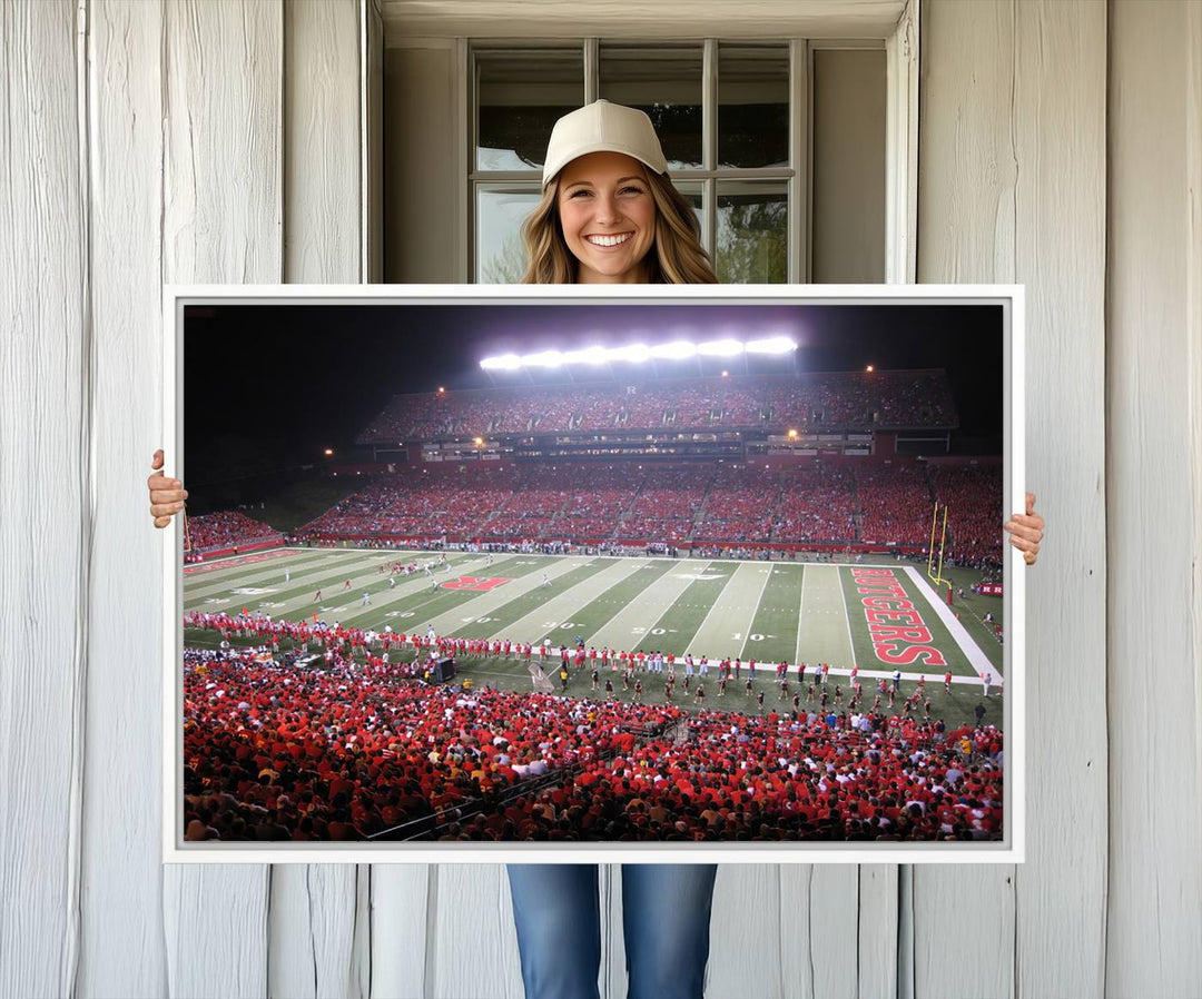 A bustling night game at SHI Stadium is captured as Rutgers Scarlet Knights wall art on a gallery-quality canvas print.