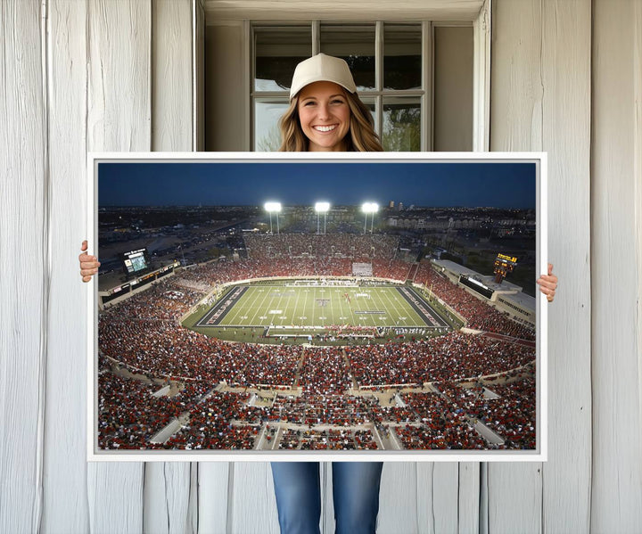 Canvas wall art featuring an aerial view of the Texas Tech Red Raiders packed night game at Lubbock’s Jones AT&T Stadium.