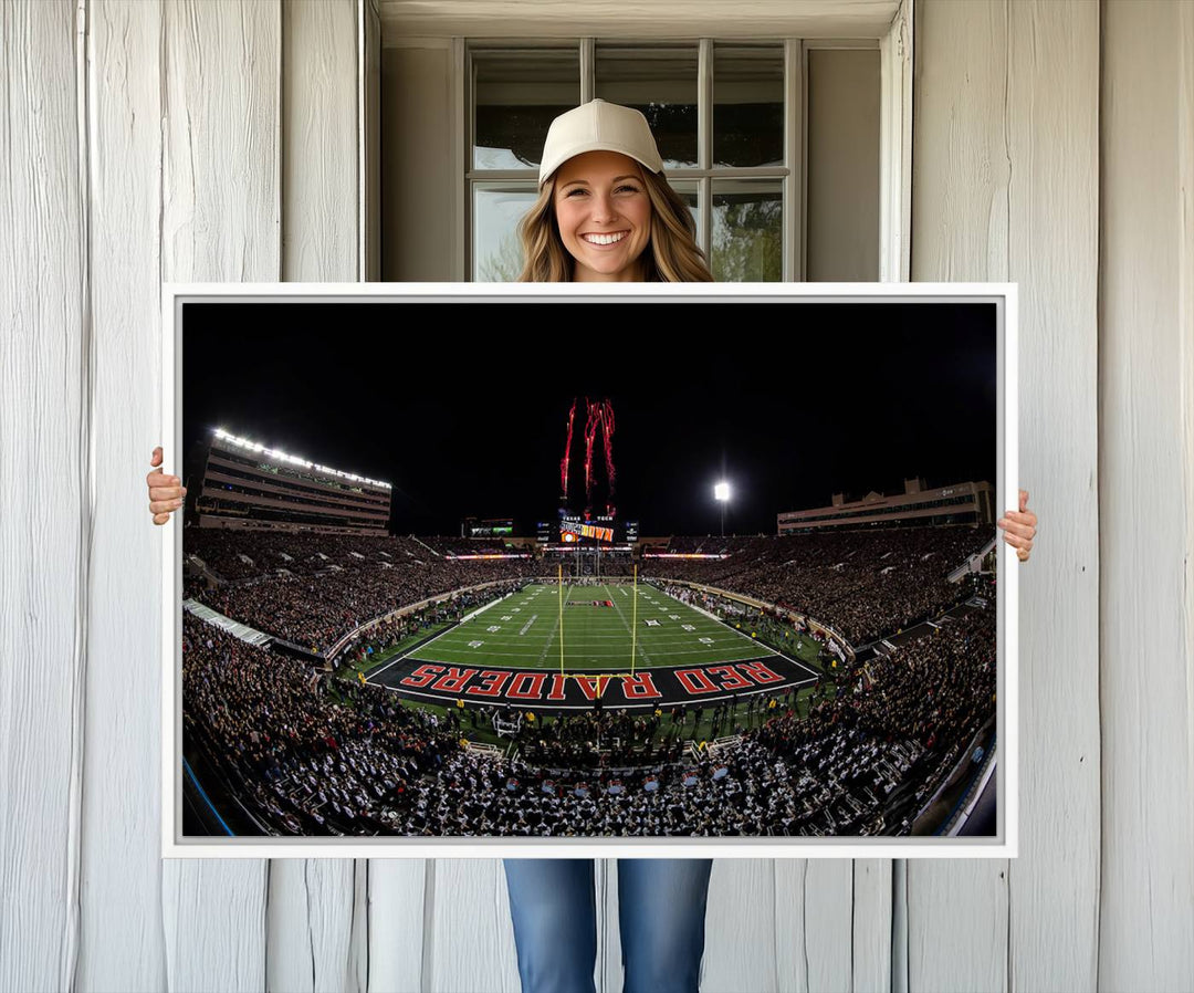 The wall features a Texas Tech Red Raiders Football Team Print on canvas, showcasing fireworks over a packed stadium at night.