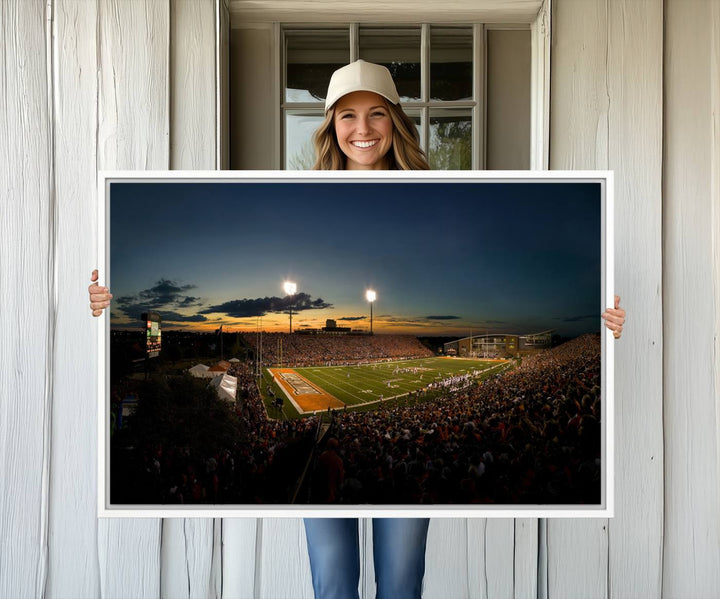 Ball State Cardinals Football Team Print - Muncie Scheumann Stadium Canvas featuring a sunset, floodlights, and lively crowd.