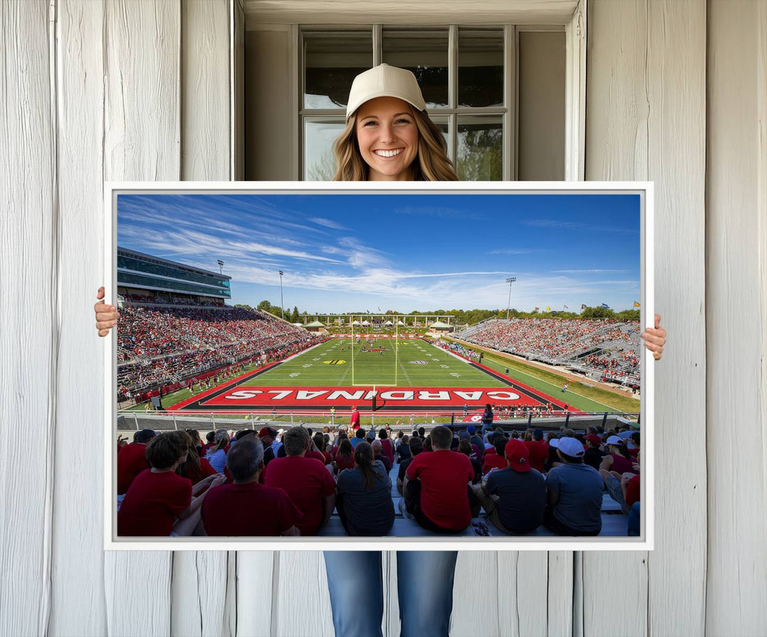 The Ball State Cardinals wall art on canvas depicts fans in red at Scheumann Stadium.