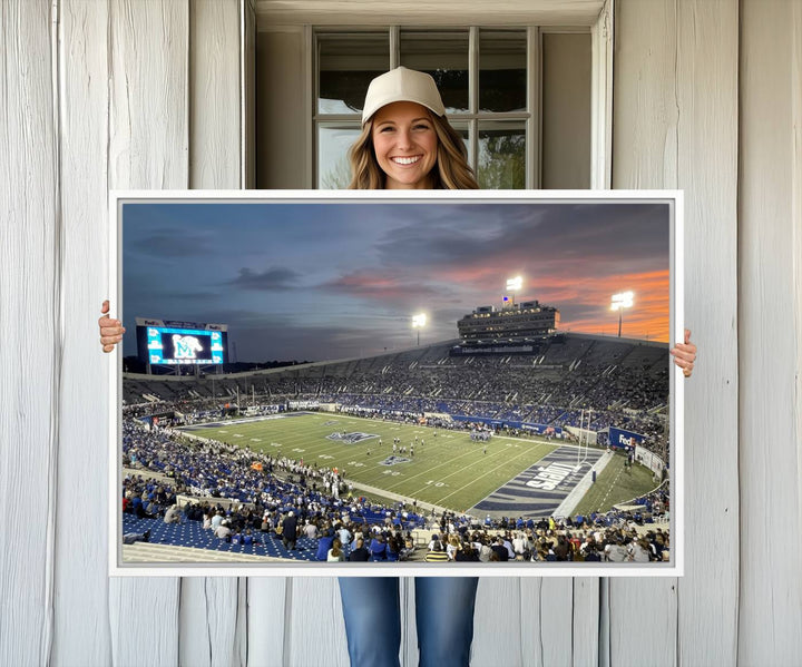 A Memphis Tigers football canvas print of Simmons Bank Liberty Stadium at sunset enhances the living room.