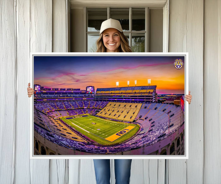 A canvas print of Tiger Stadium at sunset, depicting an empty field and stands, adorns the wall.