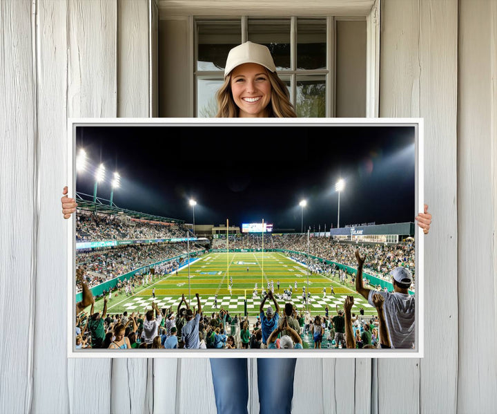 This vibrant wall art canvas print captures the excitement of fans cheering for the Tulane Green Wave Football Team under the lights of Yulman Stadium.