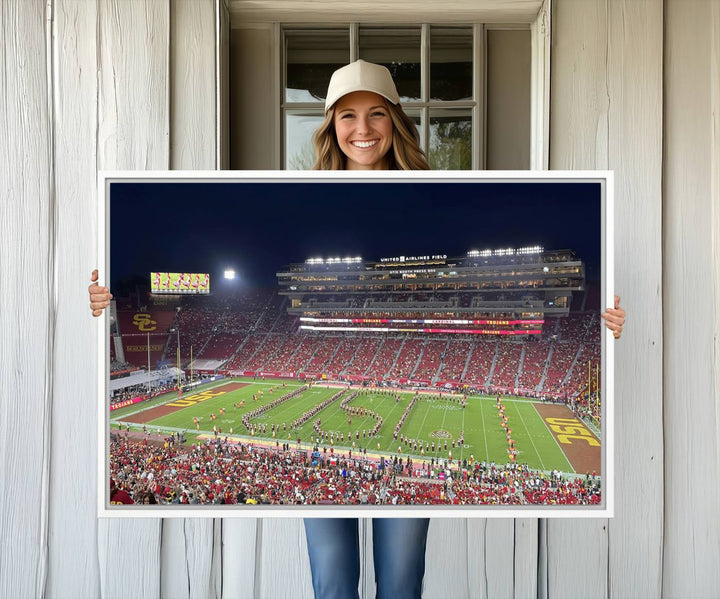 Canvas print depicting a packed stadium at night with a marching band forming USC, celebrating the Trojans at Los Angeles Memorial Coliseum.