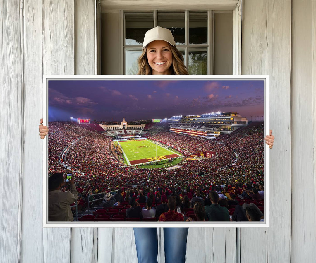 The vibrant wall art canvas print captures the USC Trojans playing under lights at dusk in LA Memorial Coliseum.