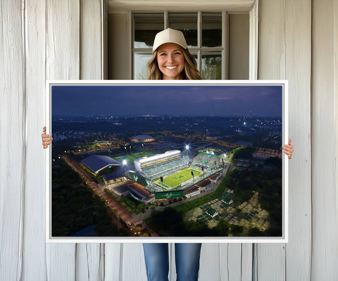 The USF Bulls Football Team Wall Art Canvas Print showcases the Tampa USF Football Stadium at night with city lights.