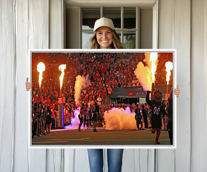 This canvas print captures the UTSA Roadrunners storming the Alamodome under smoke and fire.