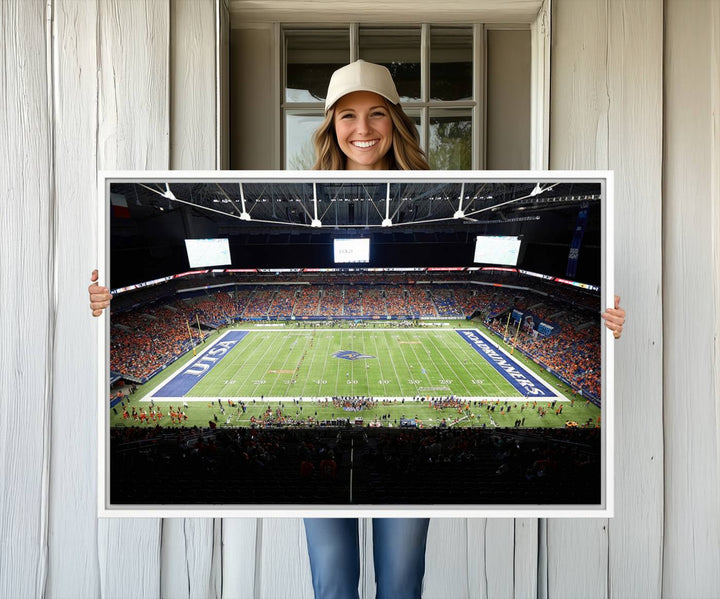 The UTSA Roadrunners game at Alamodome canvas print captures the scene from above, displaying fans and the UTSA lettering on the field.