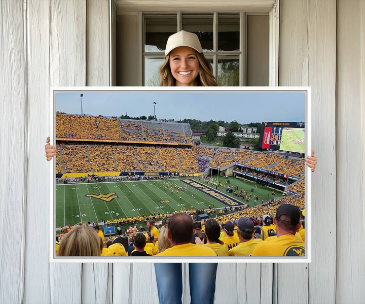 A Puskar Stadium canvas print decorates the modern living room shelf.