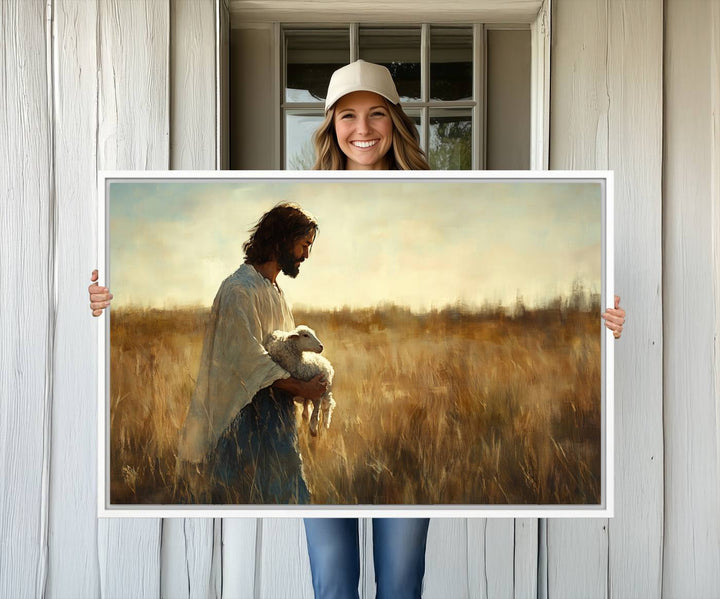 The Jesus the Good Shepherd wall art print depicts Jesus gently holding a lamb under a clear sky.