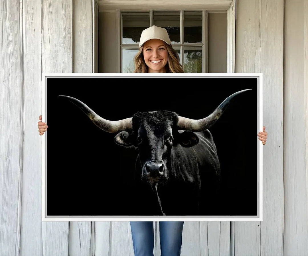 A captivating close-up canvas print of a Texas Black Longhorn with impressive curved horns set against a dark backdrop, ideal as a standout piece in your collection of Longhorn Cow Wall Art.