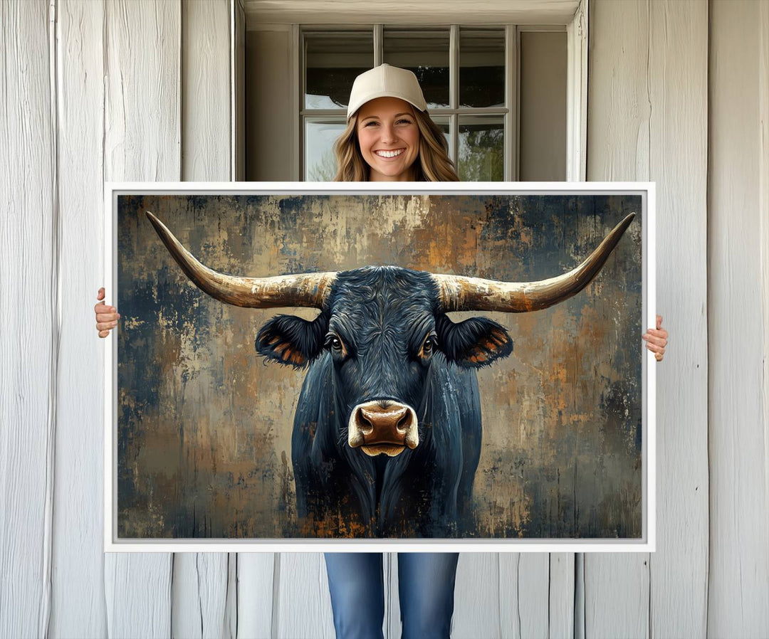 The Texas Western Wall Art Canvas Print showcases a Longhorn Bull set against an abstract brown and gray backdrop, making it perfect for rustic decor.