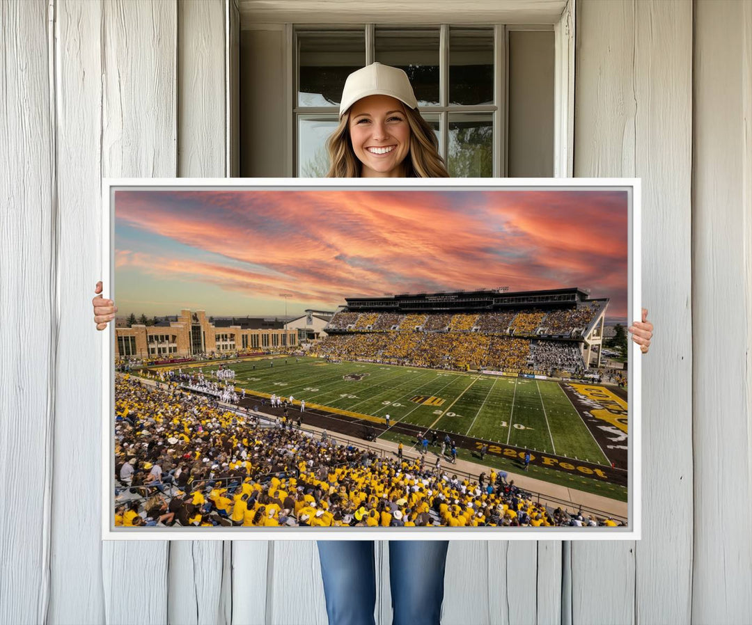 Capture the essence of a packed War Memorial Stadium at sunset with the Cowboys Football Canvas Print, highlighting fans cheering in yellow.