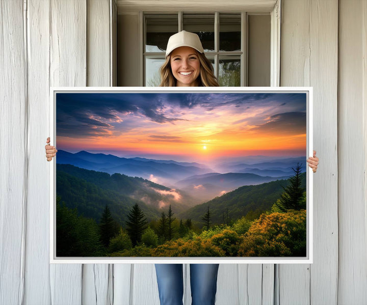 The Majestic Mountain Sunrise Print features a vibrant sky, layered hills, and evergreens, making it a stunning piece of wall decor.