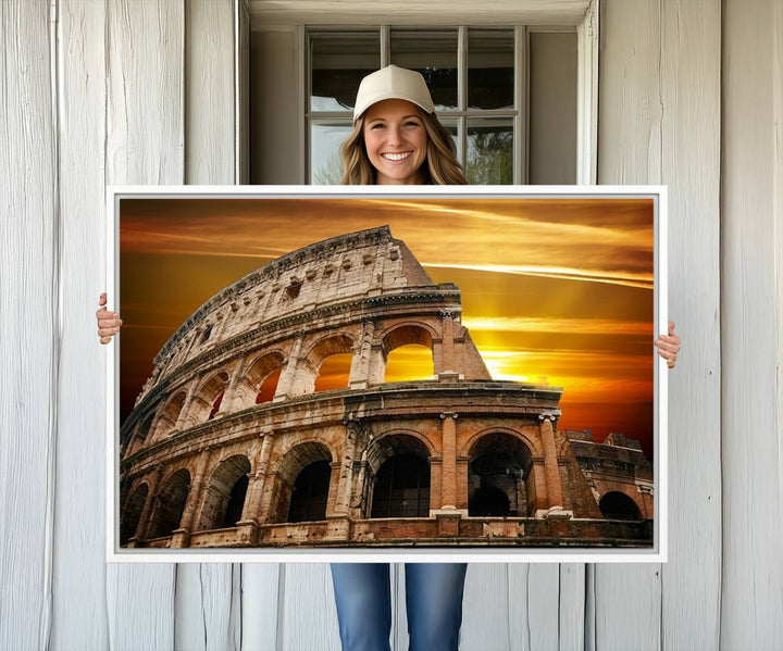 On the wall, theres a piece of art titled Colosseum with Yellow Sunset Behind, Italy.