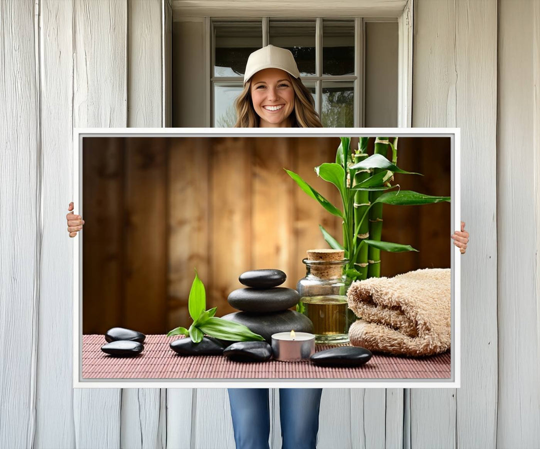 Zen Serenity Triptych Canvas Art: Pink Lotus Flower and Stones, Tranquil Water Lily Print, creating a peaceful spa ambiance.