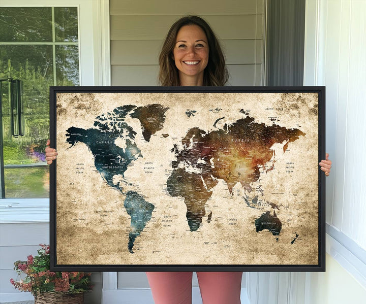 Vintage World Map Canvas Wall Art, perfect for antique-style decor, displayed against a light wood wall.