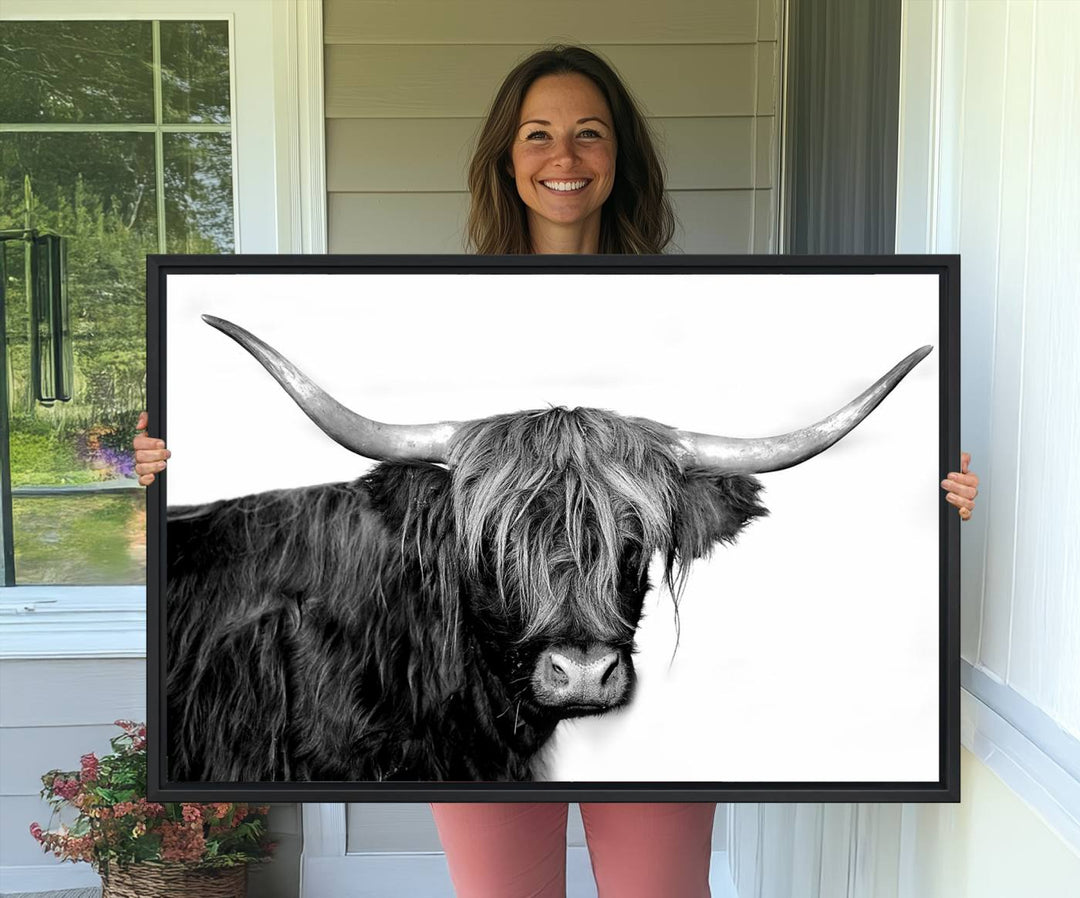 The Black and White Highland Cow Multi Panel Wall Art Canvas Print with UV-protection hangs prominently.