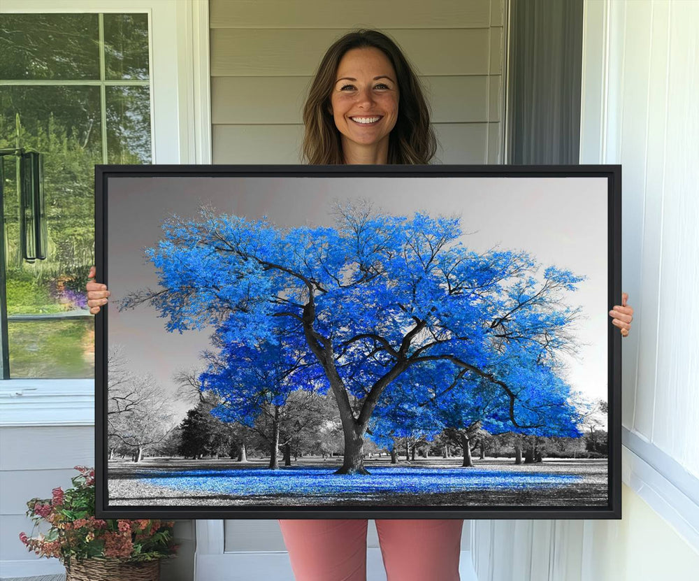 The dining area features the Vibrant Blue Tree Canvas Art amidst a grayscale landscape.